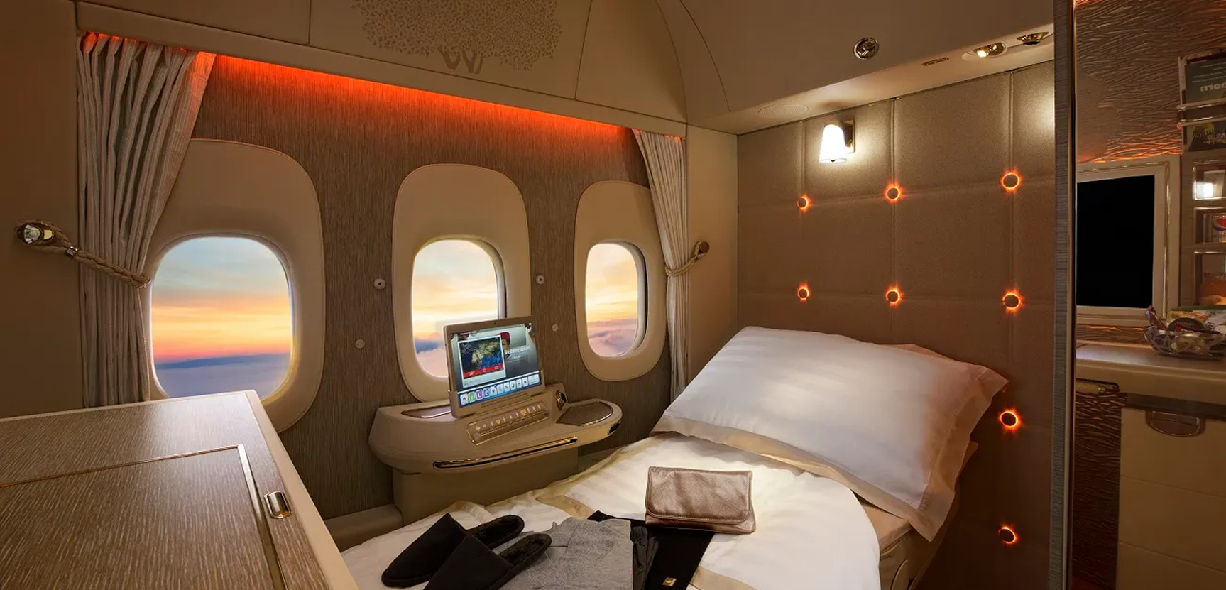 A first class private suite with a lie-flat bed made up for the night