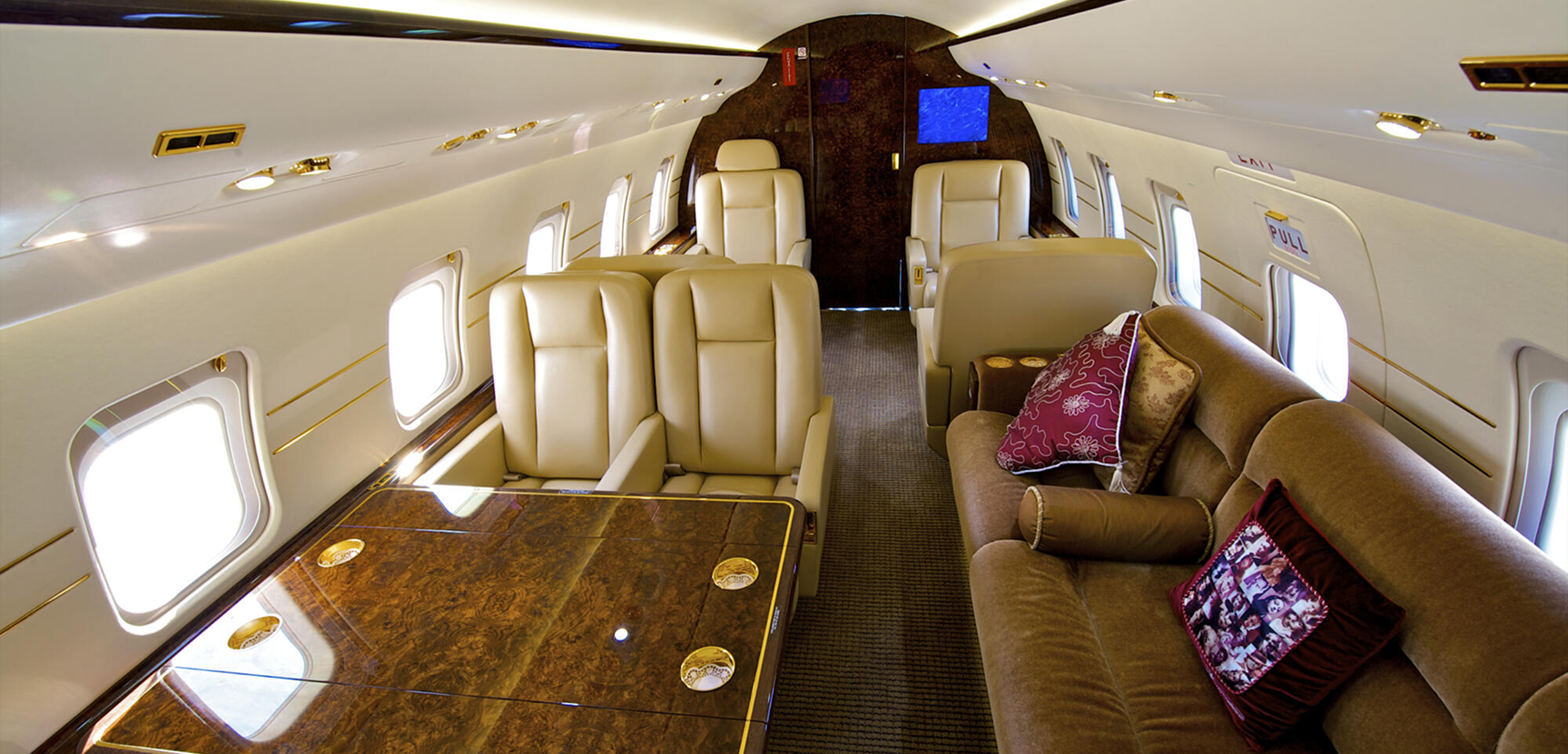 Cream leather seats in a private jet cabin