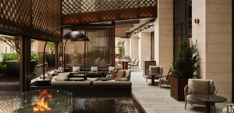 A shaded terrace lounge at a luxury hotel